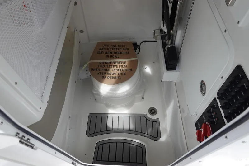 Slide: The Image of 2026 Sea Hunt Gamefish 27 Coffin Box interior with protective film and control panel. - 32