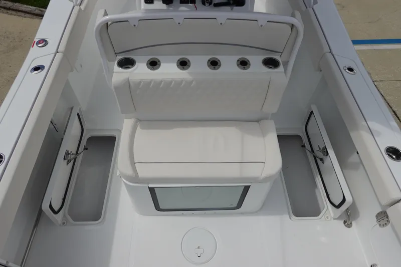 Slide: The Image of 2026 Sea Hunt Gamefish 27 Coffin Box boat interior with seating and storage compartments. - 34