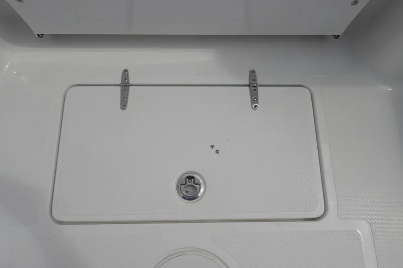 Slide: The Image of 2026 Sea Hunt Gamefish 27 Coffin Box, white deck with metal hinges and latch. - 37