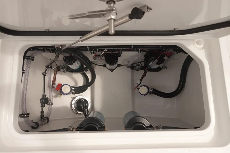 Slide: The Image of 2026 Sea Hunt Gamefish 27 Coffin Box interior, showcasing plumbing and mechanical components. - 38