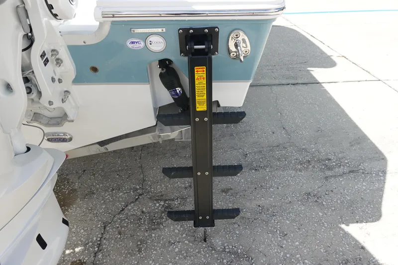 Slide: The Image of Rear view of 2026 Sea Hunt Gamefish 27 Coffin Box boat ladder on concrete surface. - 7