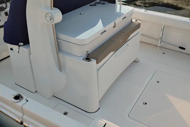 Slide: The Image of 2021 Edgewater 370CC boat interior with seating and storage compartments. - 5