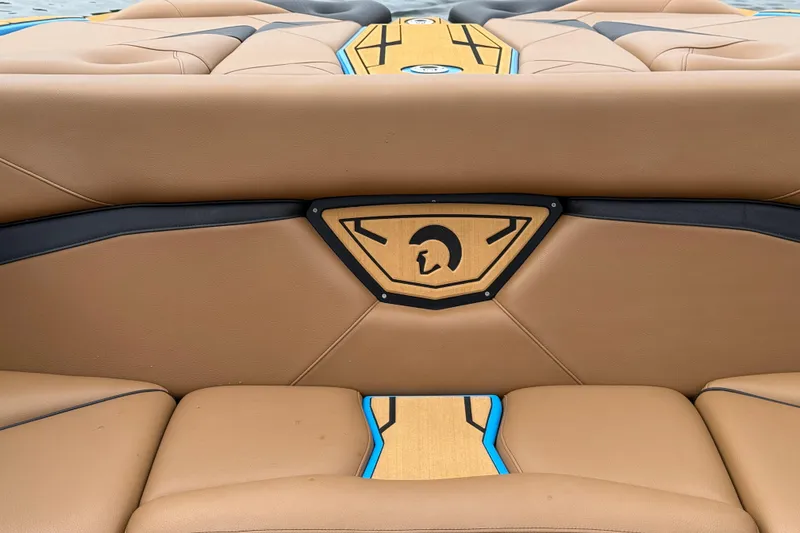 Slide: The Image of 2025 Centurion Nv233 boat interior with tan and black leather seating. - 16