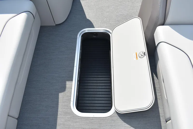 Slide: The Image of 2026 Godfrey Sweetwater SW 2286 C boat storage compartment with open hatch. - 16