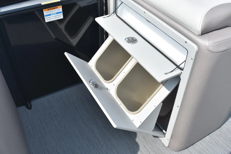 Slide: The Image of Storage compartment on 2026 Godfrey Sweetwater SW 2286 C boat, featuring dual bins. - 17