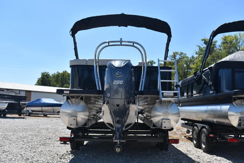 Slide: The Image of 2026 Godfrey Sweetwater 2286C Tritoon with Yamaha 200 engine, parked outdoors. - 3