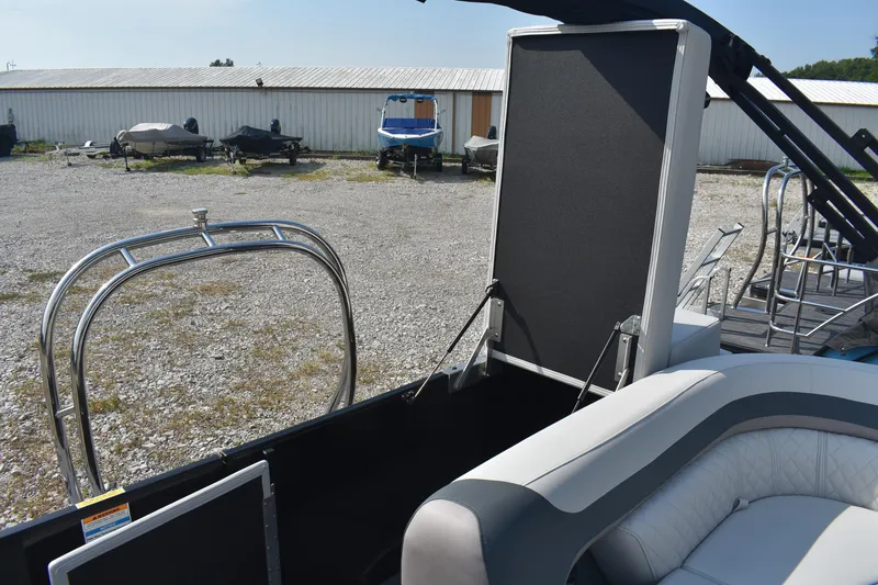 Slide: The Image of 2026 Godfrey Sweetwater SW 2286 C pontoon boat interior with open storage compartment. - 9