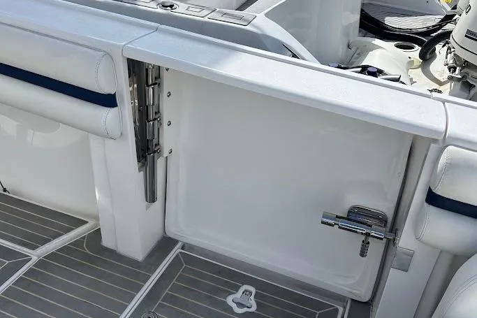 Slide: The Image of 2017 Intrepid boat interior with white seating and stainless steel hardware. - 12