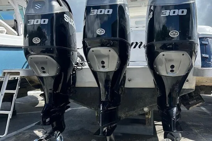 Slide: The Image of Triple Suzuki 300 outboard motors on a 2017 Intrepid boat. - 13
