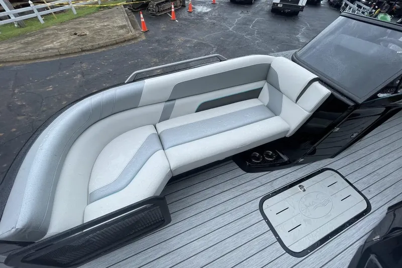 Slide: The Image of Luxurious seating on 2025 G 3 Amara boat, featuring sleek gray and white upholstery. - 4