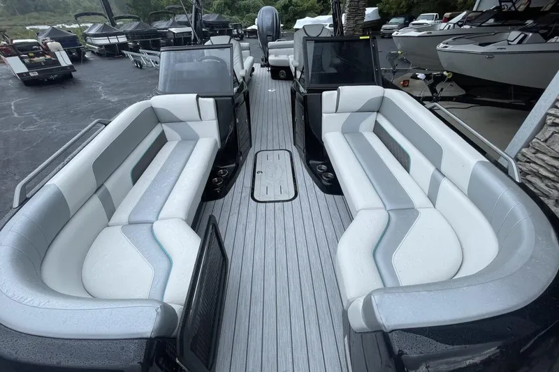 Slide: The Image of 2025 G 3 Amara boat with spacious seating and sleek design in a showroom. - 7