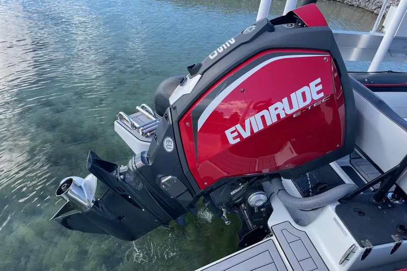 Slide: The Image of 2019 Zodiac Open 7 with Evinrude E-TEC outboard motor in clear water. - 13