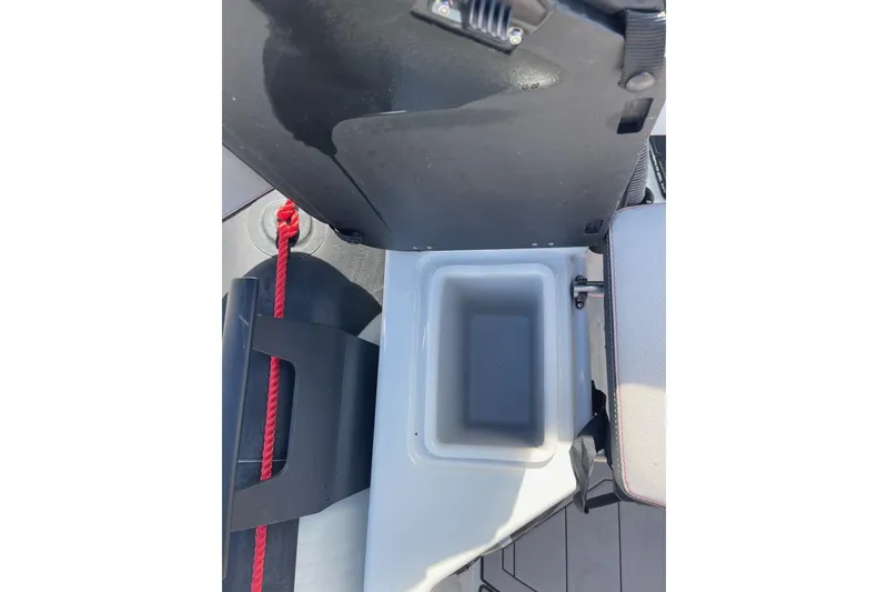 Slide: The Image of 2019 Zodiac Open 7 boat interior with storage compartment and red rope detail. - 19