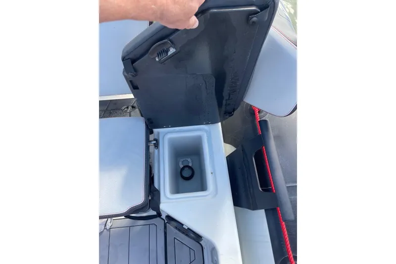 Slide: The Image of 2019 Zodiac Open 7 boat storage compartment with open lid and visible interior. - 21