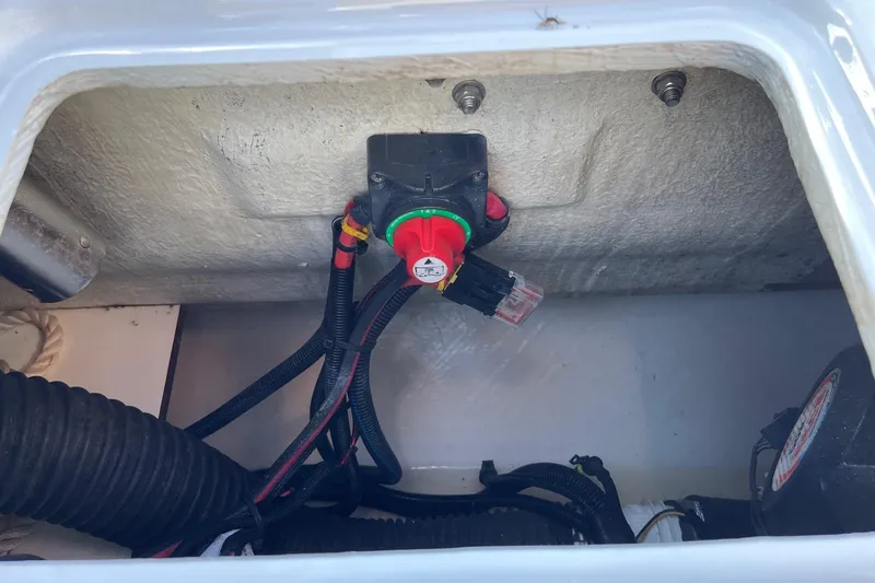 Slide: The Image of Electrical wiring and switch inside a 2019 Zodiac Open 7 boat compartment. - 22