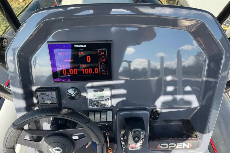 Slide: The Image of 2019 Zodiac Open 7 dashboard with Simrad display and control panel. - 23