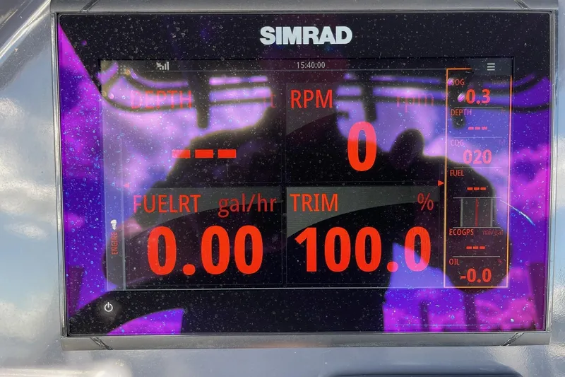 Slide: The Image of Simrad display on 2019 Zodiac Open 7 showing RPM, fuel rate, and trim settings. - 24