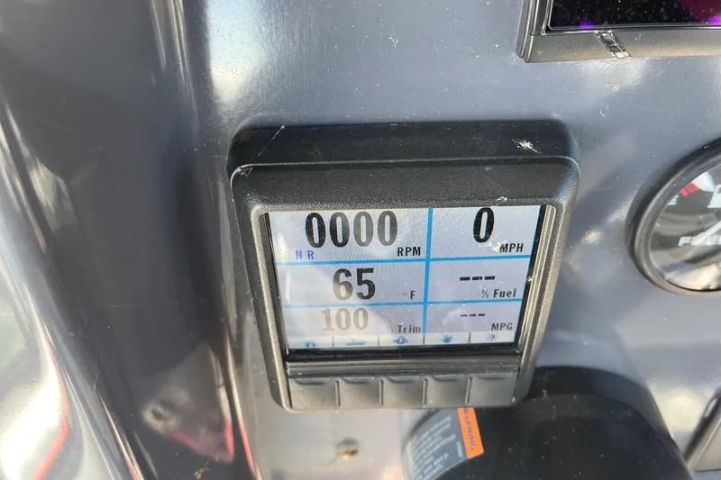 Slide: The Image of Close-up of 2019 Zodiac Open 7 dashboard display showing RPM, speed, and fuel data. - 25