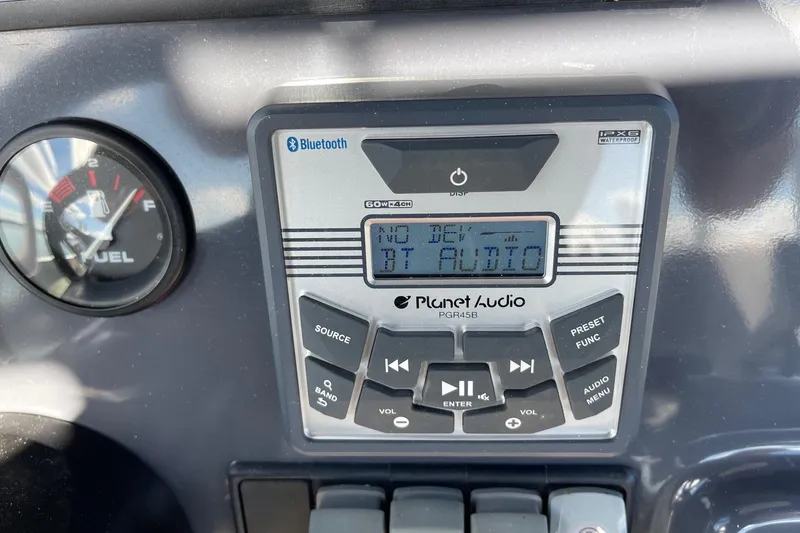 Slide: The Image of Control panel of a 2019 Zodiac Open 7 boat with Planet Audio system. - 26
