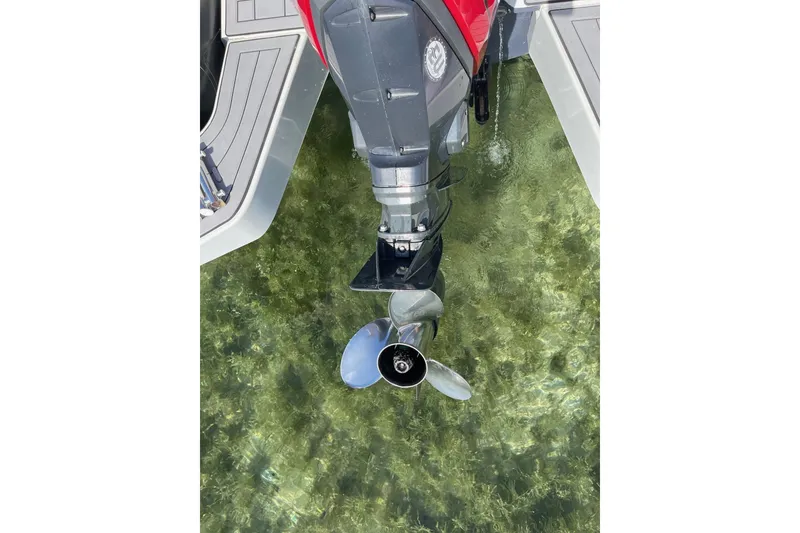 Slide: The Image of 2019 Zodiac Open 7 boat motor in clear water, showcasing propeller detail. - 31