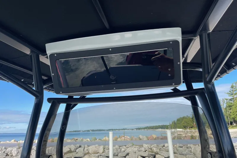 Slide: The Image of 2019 Zodiac Open 7 boat console with scenic waterfront view. - 4