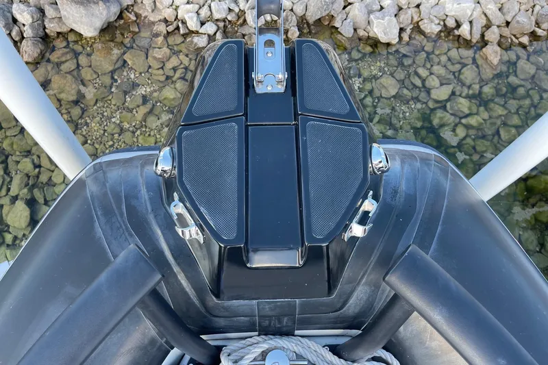 Slide: The Image of 2019 Zodiac Open 7 boat bow with rocky shoreline background. - 7