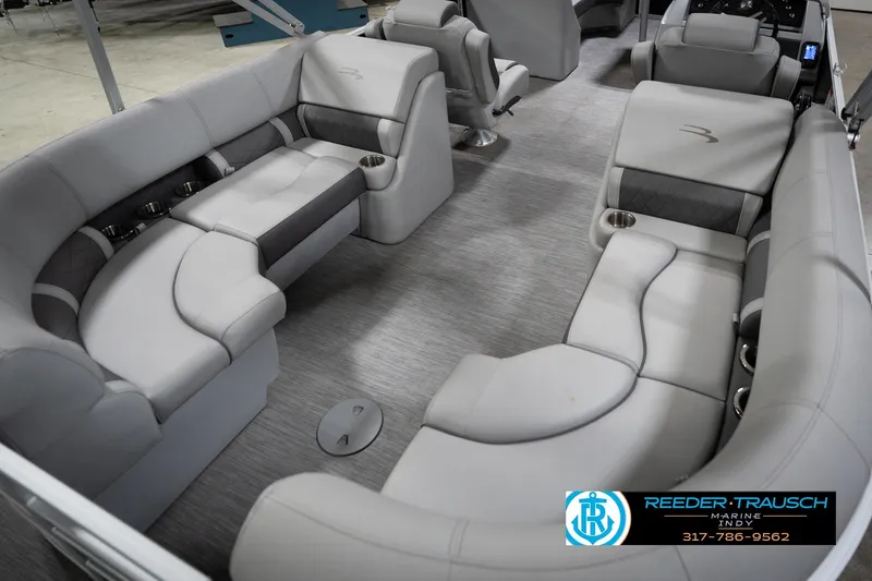 Slide: The Image of 2023 Bennington 22 LSR boat interior with luxurious gray seating and cup holders. - 13