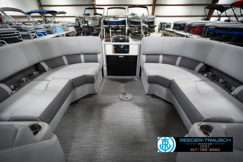 Slide: The Image of 2023 Bennington 22 LSR pontoon boat interior with gray seating and cup holders. - 17