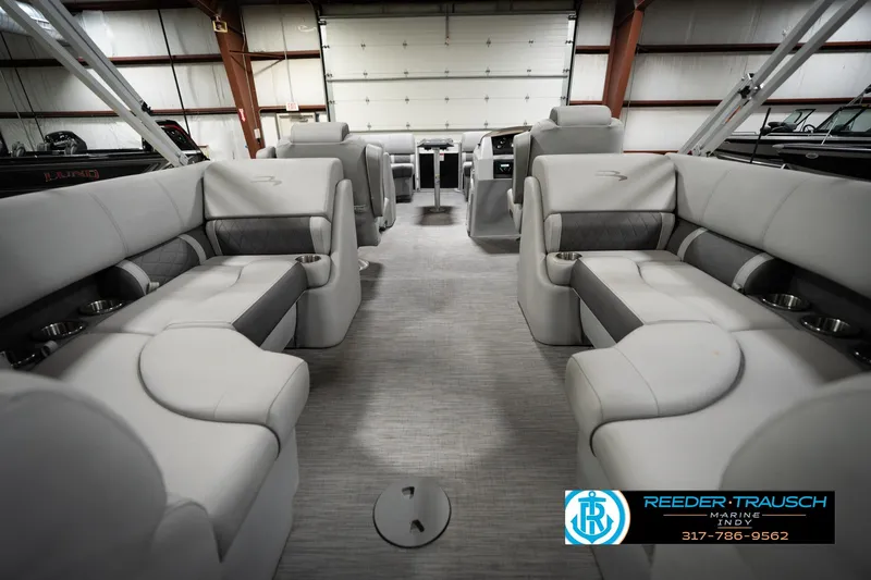 Slide: The Image of 2023 Bennington 22 LSR pontoon boat interior with luxurious seating and modern design. - 18