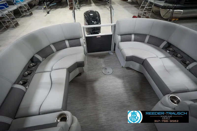 Slide: The Image of 2023 Bennington 22 LSR pontoon boat interior with gray seating and cup holders. - 25
