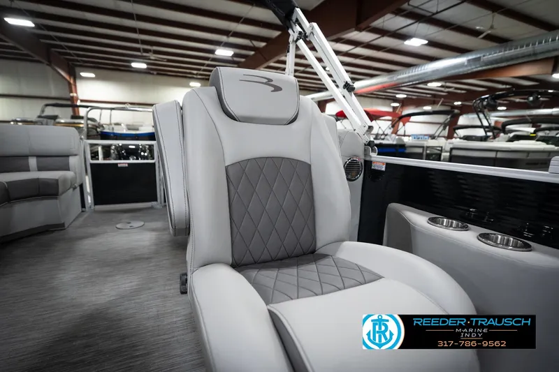 Slide: The Image of Luxurious seating on 2023 Bennington 22 LSR boat, featuring diamond-stitched upholstery in showroom. - 27