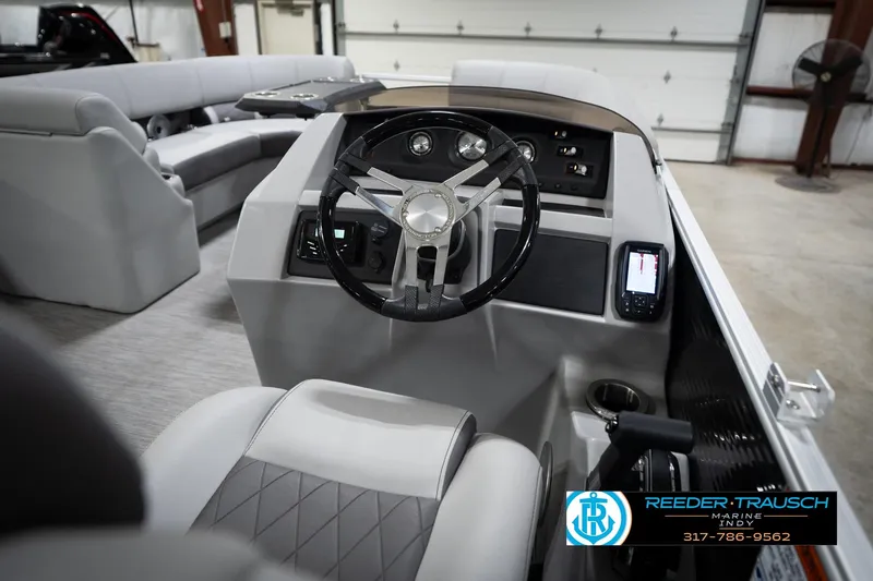Slide: The Image of 2023 Bennington 22 LSR boat interior with steering wheel and seating. - 29