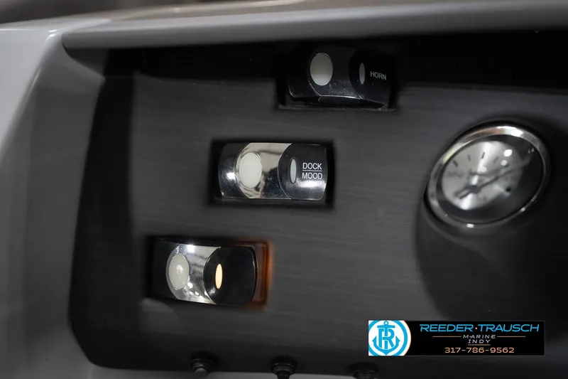 Slide: The Image of Control panel of 2023 Bennington 22 LSR boat with switches and gauge. - 33
