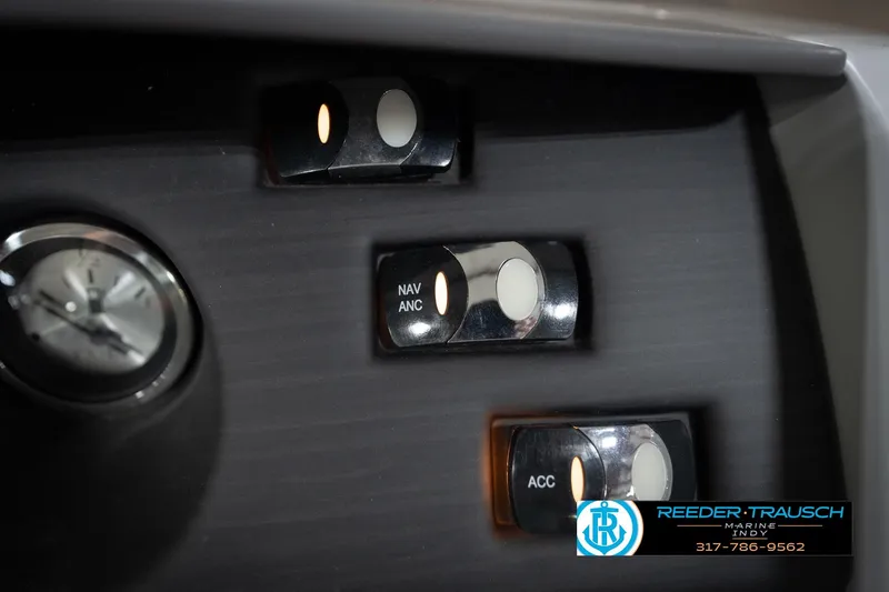 Slide: The Image of Dashboard switches and clock on 2023 Bennington 22 LSR boat. - 35