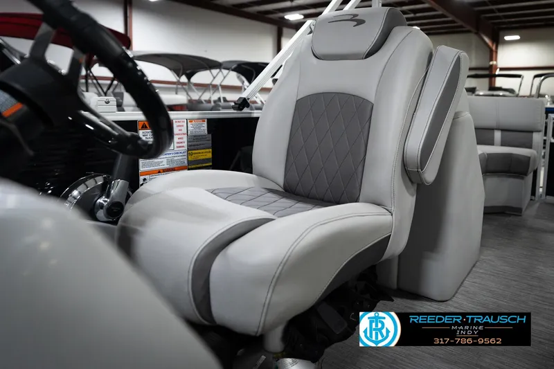 Slide: The Image of Captain's seat of 2023 Bennington 22 LSR pontoon boat, featuring luxurious gray upholstery. - 38