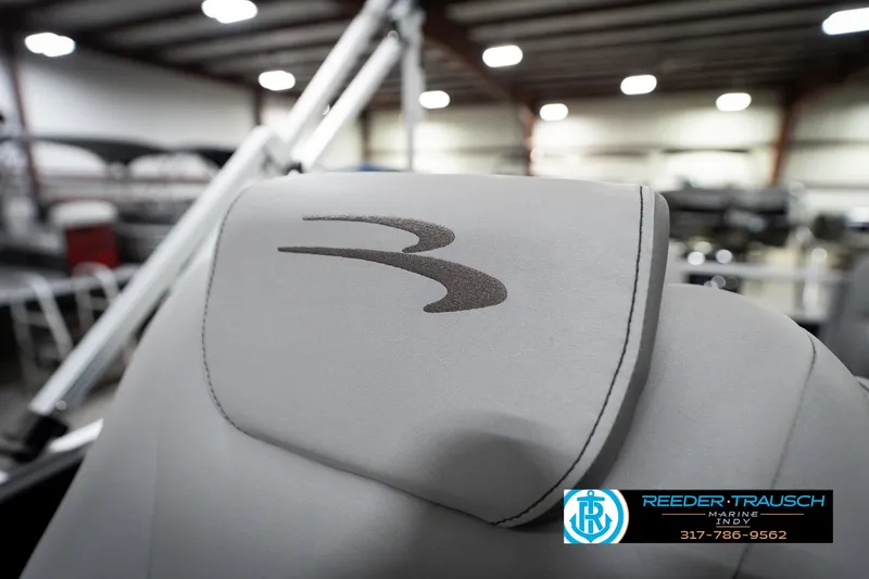 Slide: The Image of 2023 Bennington 22 LSR boat seat with logo in showroom setting. - 39