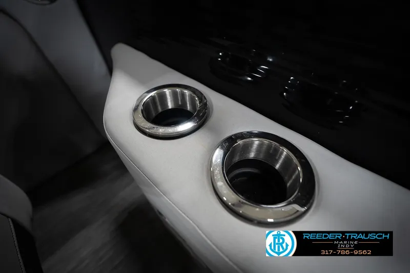 Slide: The Image of 2023 Bennington 22 LSR boat interior with dual stainless steel cup holders. - 44