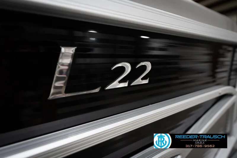 Slide: The Image of 2023 Benington 22 LSR boat close-up with Reeder-Trausch Marine logo. - 51