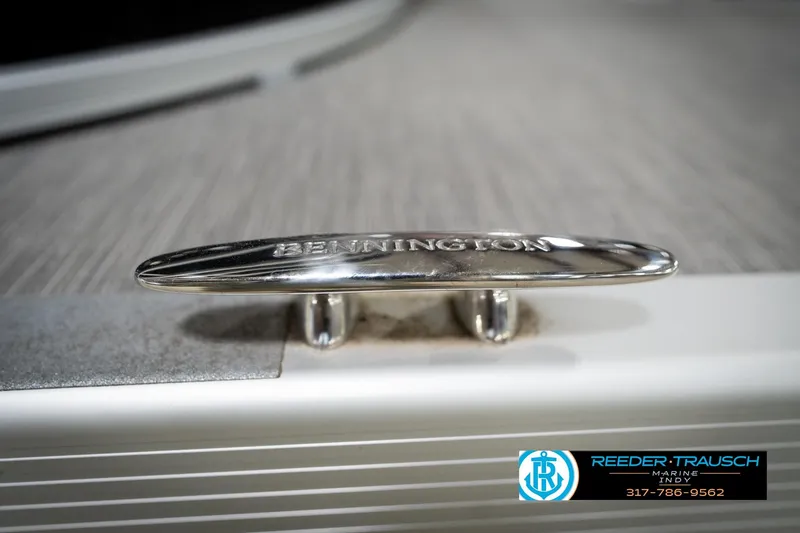 Slide: The Image of Close-up of a 2023 Benington 22 LSR boat cleat with engraved branding. - 55