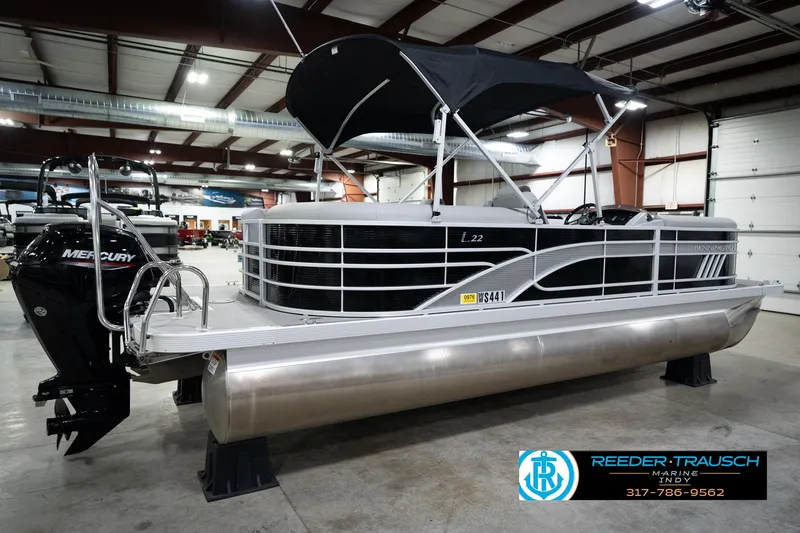 Slide: The Image of 2023 Bennington 22 LSR pontoon boat with Mercury engine in showroom. - 7