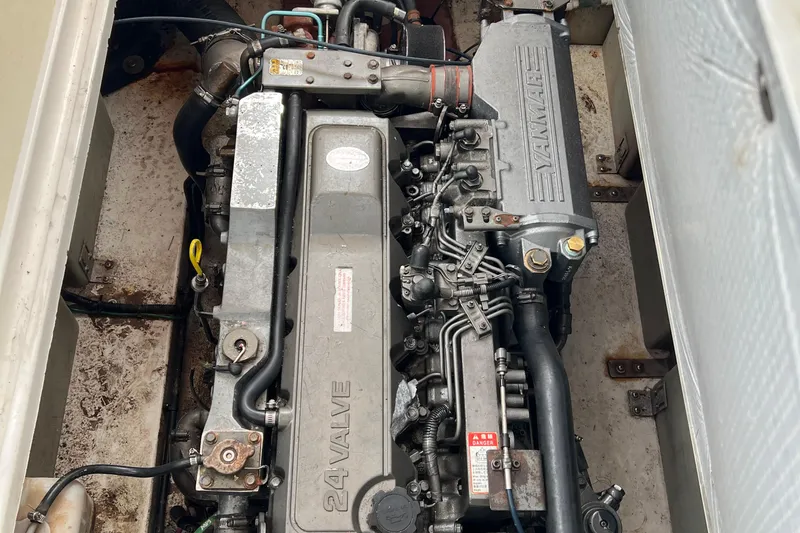 Slide: The Image of Engine compartment of a 2005 Legacy Yachts 28, featuring a Yanmar 24-valve engine. - 11