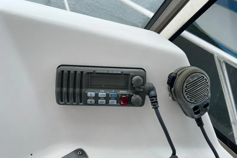 Slide: The Image of VHF marine radio and microphone on 2005 Legacy Yachts 28 dashboard. - 9