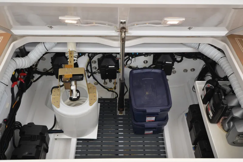 Slide: The Image of Engine compartment of 2020 MJM 43z boat, featuring organized storage and mechanical components. - 17