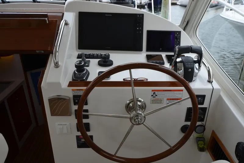 Slide: The Image of Helm of 2020 MJM 43z yacht with steering wheel and navigation controls. - 24