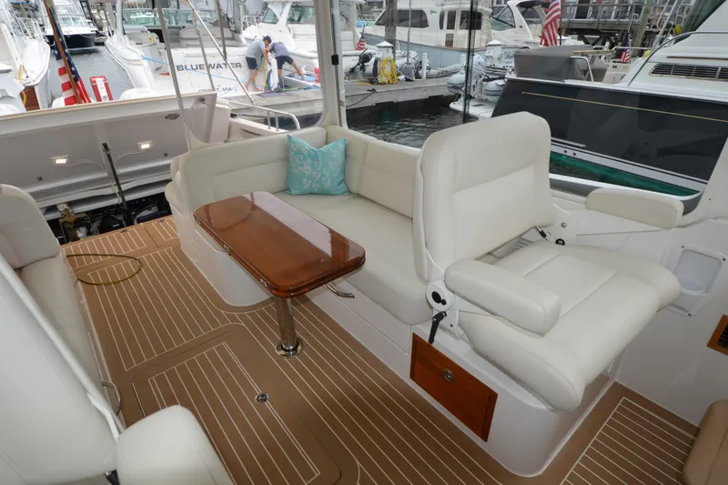 Slide: The Image of Luxurious 2020 MJM 43z yacht interior with plush seating and elegant wooden table. - 26