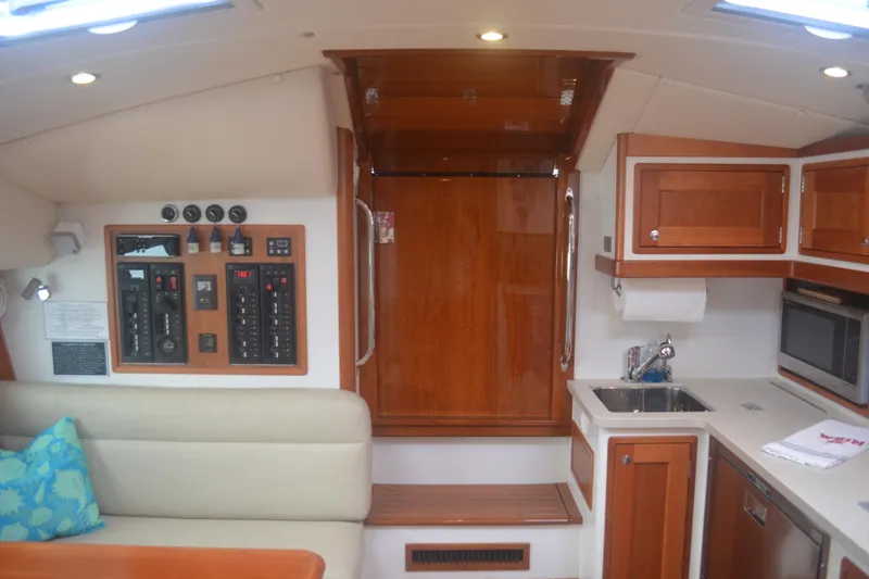 Slide: The Image of Interior of 2020 MJM 43z yacht featuring kitchen and control panel. - 28