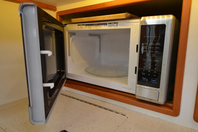 Slide: The Image of Open microwave oven inside MJM 43z yacht, 2020 model, with digital control panel. - 34