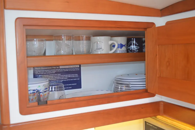 Slide: The Image of Wooden cabinet with glassware and mugs inside MJM 43z yacht, 2020 model. - 35