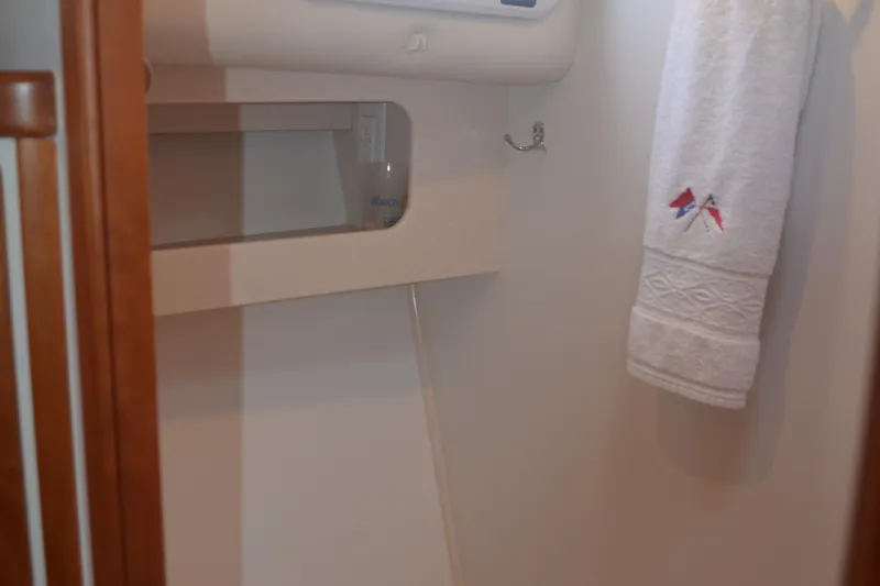 Slide: The Image of Interior of 2020 MJM 43z yacht bathroom with towel and storage shelf. - 38