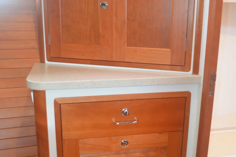 Slide: The Image of Wooden cabinetry inside 2020 MJM 43z boat, featuring sleek design and polished finish. - 42